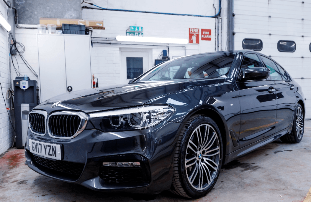 Black BMW parked inside the MOT Eastbourne test centre